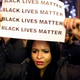Demonstrators hold signs during a protest in New York Dec. 3, 2014, after a grand jury decided not to indict the police officer who killed Staten Island, N.Y., dad Eric Garner after putting him in a choke hold during an attempted arrest in July.
Yana Paskova/Getty Images